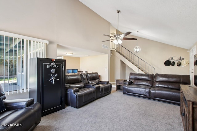 living room featuring visible vents, ceiling fan, stairway, carpet floors, and high vaulted ceiling