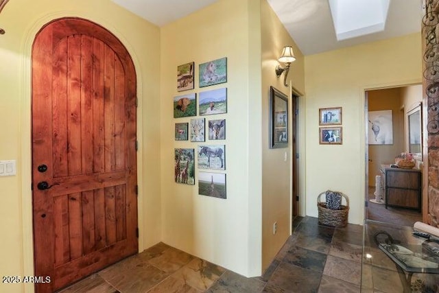 entryway featuring a skylight