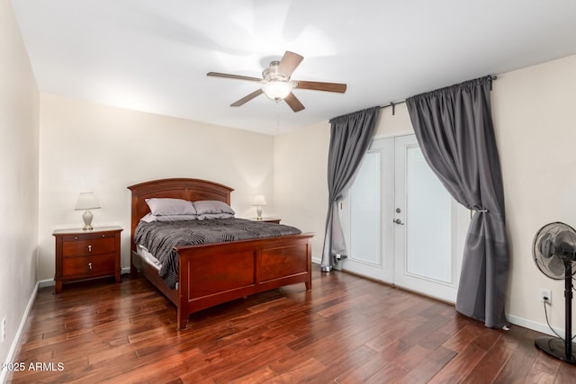 bedroom featuring baseboards, dark wood-type flooring, and a ceiling fan