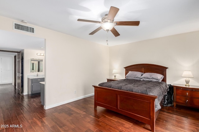 bedroom with dark wood-type flooring, baseboards, visible vents, and ceiling fan