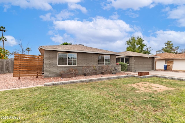 ranch-style home featuring a front yard, fence, an attached garage, and driveway