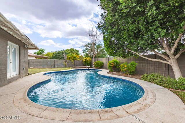 view of swimming pool featuring a fenced backyard and a fenced in pool