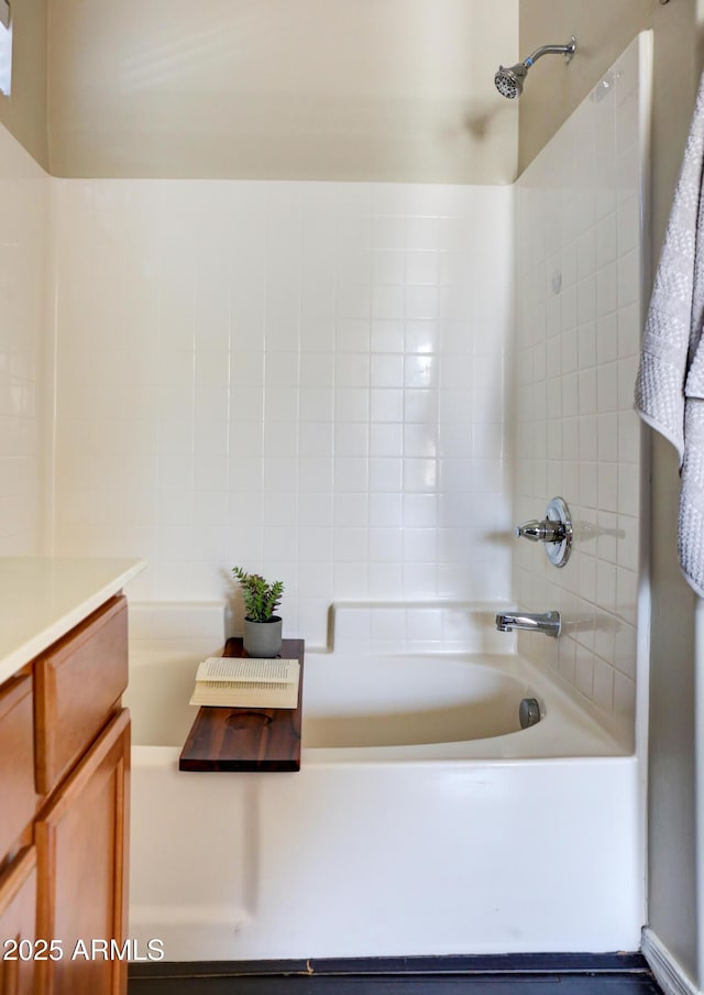 bathroom with shower / bathtub combination and vanity