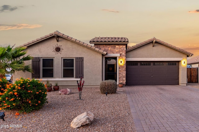 mediterranean / spanish house featuring a garage