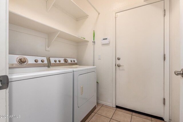 3756 E Kerry Ln, Phoenix, AZ 85050 - laundry room with washing machine and clothes dryer and light tile patterned floors