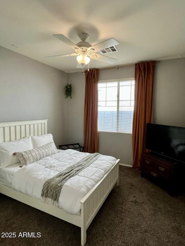 3756 E Kerry Ln, Phoenix, AZ 85050 - bedroom with dark colored carpet and a ceiling fan