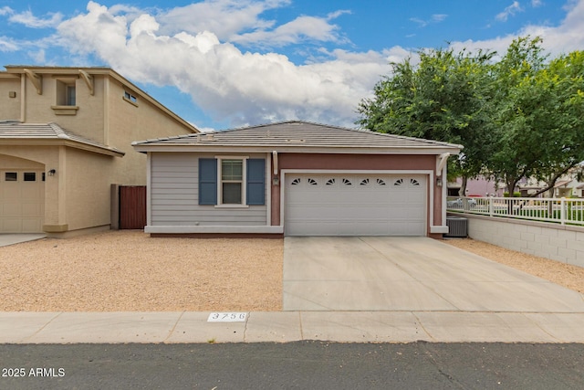 3756 E Kerry Ln, Phoenix, AZ 85050 - view of front facade featuring driveway, central AC, and an attached garage