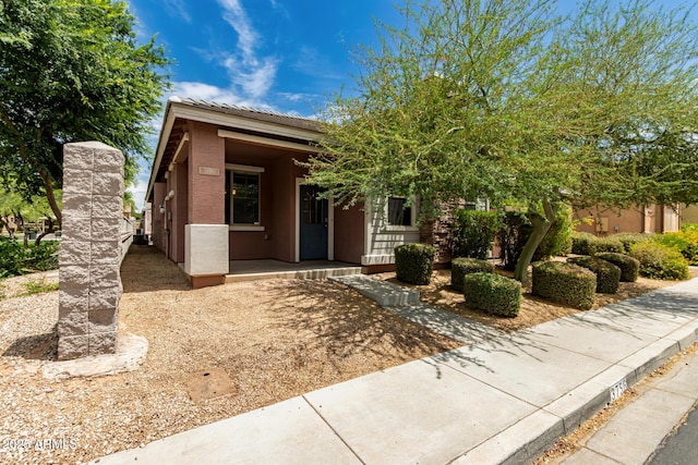 3756 E Kerry Ln, Phoenix, AZ 85050 - view of front of home featuring a porch, stucco siding, and a tiled roof