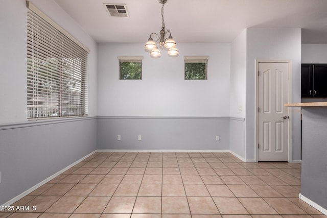 3756 E Kerry Ln, Phoenix, AZ 85050 - unfurnished room featuring a chandelier, light tile patterned floors, and baseboards