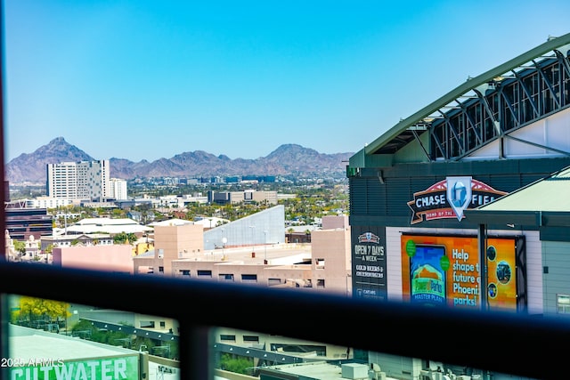 exterior space featuring a city view and a mountain view