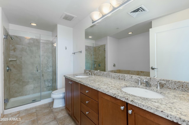 bathroom with a sink, visible vents, and toilet