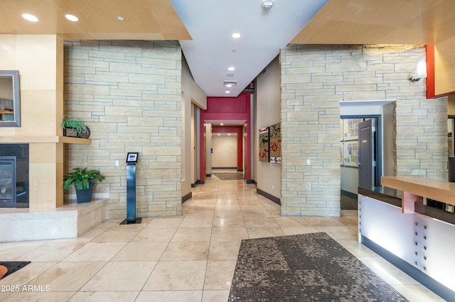 hall with light tile patterned flooring and recessed lighting