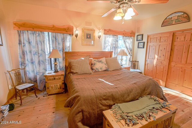 2353 Florian Meadow Trl, Overgaard, AZ 85933 - bedroom with a closet, a ceiling fan, and hardwood / wood-style floors