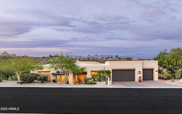 15816 E Eagle Crest Rd, Fountain Hills, AZ 85268 - adobe home featuring a garage, a mountain view, stucco siding, and decorative driveway