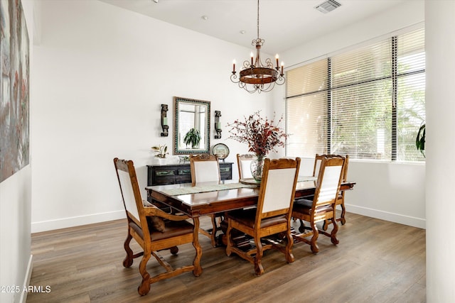 15816 E Eagle Crest Rd, Fountain Hills, AZ 85268 - dining space featuring baseboards, wood finished floors, and a chandelier