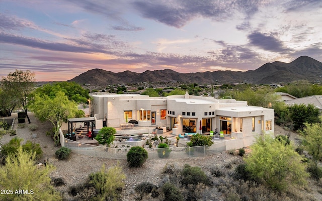15816 E Eagle Crest Rd, Fountain Hills, AZ 85268 - back of property with a fenced backyard, a patio, stucco siding, and a mountain view