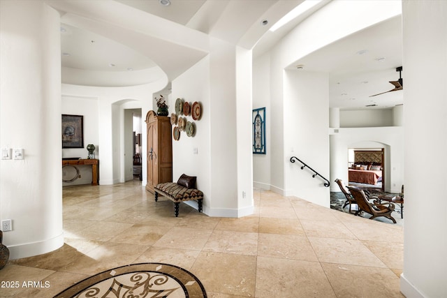 15816 E Eagle Crest Rd, Fountain Hills, AZ 85268 - hallway featuring arched walkways, baseboards, and a towering ceiling