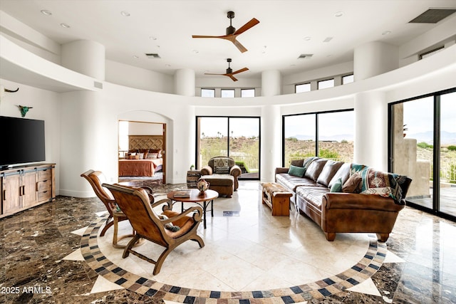 15816 E Eagle Crest Rd, Fountain Hills, AZ 85268 - living room with plenty of natural light, marble tiled floors, recessed lighting, a ceiling fan, and a high ceiling
