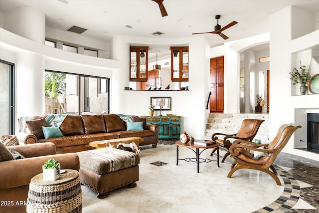 15816 E Eagle Crest Rd, Fountain Hills, AZ 85268 - living room featuring a ceiling fan and arched walkways