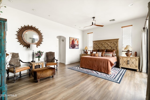 15816 E Eagle Crest Rd, Fountain Hills, AZ 85268 - bedroom featuring arched walkways, wood finished floors, baseboards, and ceiling fan