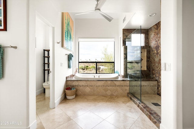 15816 E Eagle Crest Rd, Fountain Hills, AZ 85268 - bathroom with a garden tub, a shower stall, ceiling fan, tile patterned flooring, and baseboards