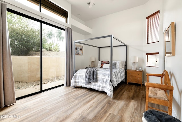 15816 E Eagle Crest Rd, Fountain Hills, AZ 85268 - bedroom featuring access to exterior, wood finished floors, and a high ceiling