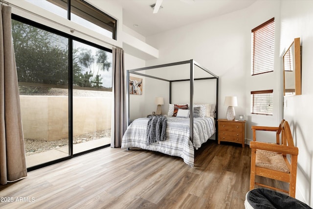 15816 E Eagle Crest Rd, Fountain Hills, AZ 85268 - bedroom with access to exterior, wood finished floors, and a towering ceiling