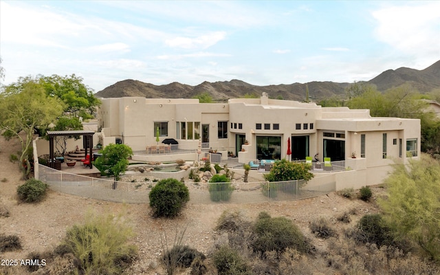 15816 E Eagle Crest Rd, Fountain Hills, AZ 85268 - back of house featuring a fenced backyard, a patio area, a mountain view, stucco siding, and a chimney