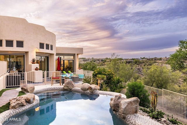 15816 E Eagle Crest Rd, Fountain Hills, AZ 85268 - pool at dusk with a patio area