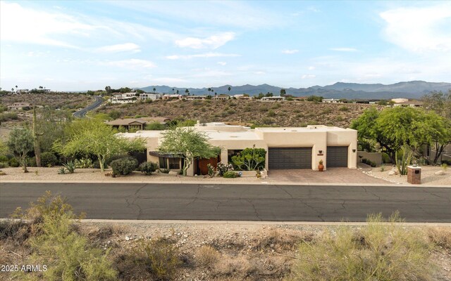 15816 E Eagle Crest Rd, Fountain Hills, AZ 85268 - adobe home with a garage, a mountain view, driveway, and stucco siding