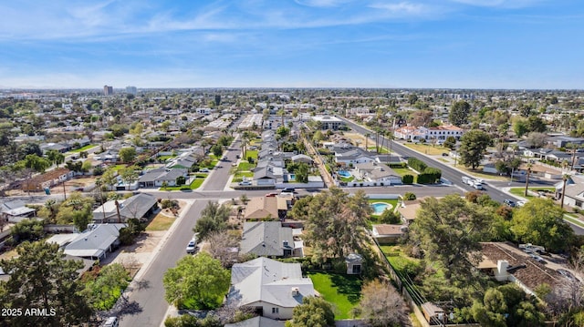birds eye view of property with a residential view