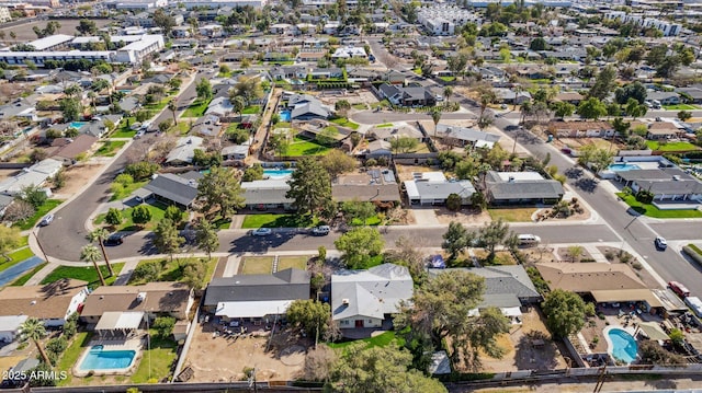birds eye view of property with a residential view