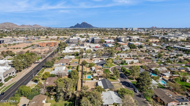 birds eye view of property featuring a mountain view
