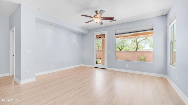 3439 W Darien Way, Phoenix, AZ 85086 - spare room with light wood-type flooring, a ceiling fan, and baseboards