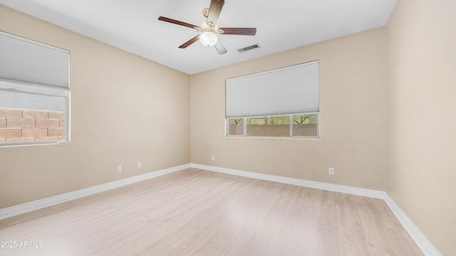 3439 W Darien Way, Phoenix, AZ 85086 - unfurnished room with wood finished floors, a ceiling fan, and baseboards