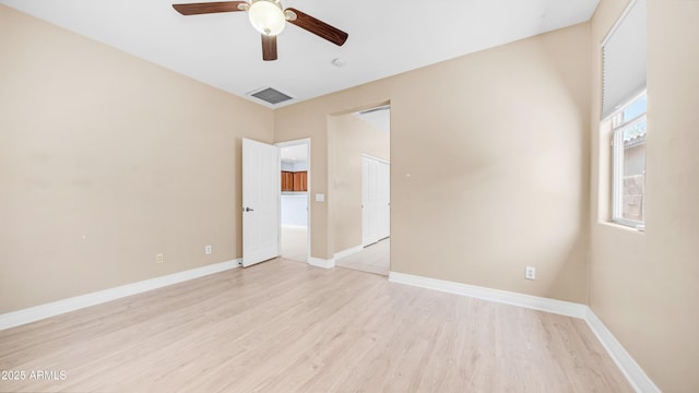 3439 W Darien Way, Phoenix, AZ 85086 - unfurnished room featuring light wood-type flooring, a ceiling fan, and baseboards