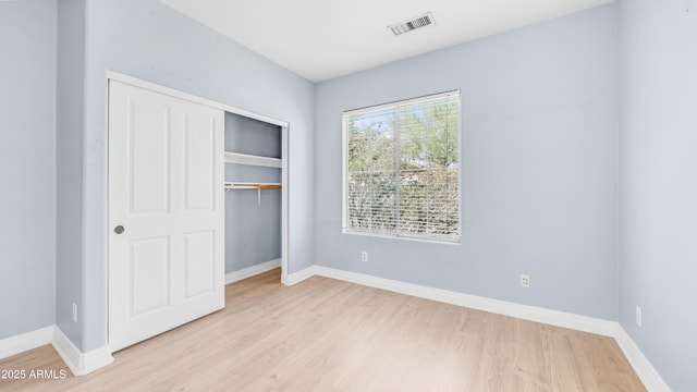 3439 W Darien Way, Phoenix, AZ 85086 - unfurnished bedroom with light wood-type flooring, a closet, and baseboards