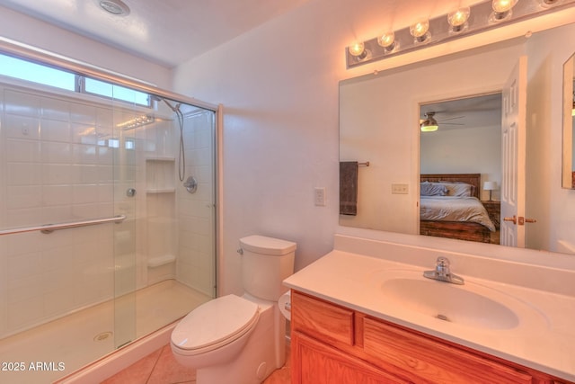 2386 Skyview Dr, Sierra Vista, AZ 85635 - full bath featuring connected bathroom, ceiling fan, vanity, toilet, and a shower stall