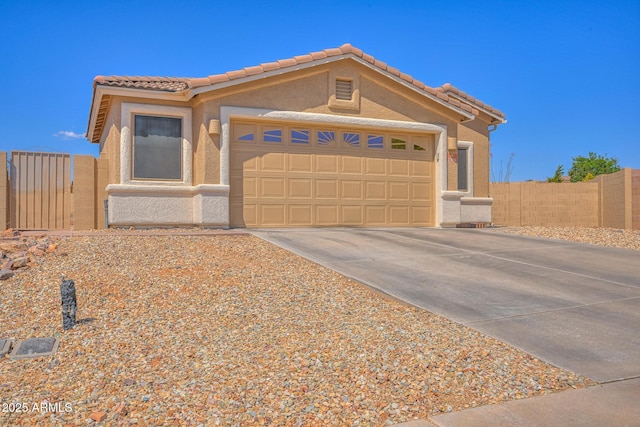 2386 Skyview Dr, Sierra Vista, AZ 85635 - view of front of home with an attached garage, concrete driveway, stucco siding, and a tiled roof