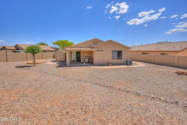 2386 Skyview Dr, Sierra Vista, AZ 85635 - rear view of house featuring central AC, stucco siding, a fenced backyard, and a patio area