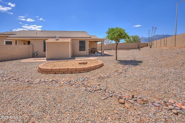 2386 Skyview Dr, Sierra Vista, AZ 85635 - back of house featuring a patio, a fenced backyard, stucco siding, and a tiled roof