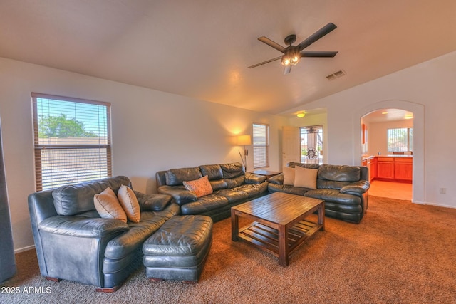 2386 Skyview Dr, Sierra Vista, AZ 85635 - living room featuring arched walkways, carpet, ceiling fan, plenty of natural light, and vaulted ceiling