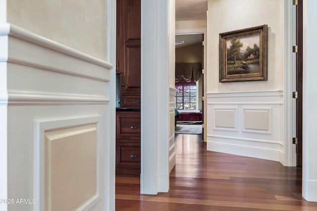 corridor with dark hardwood / wood-style floors