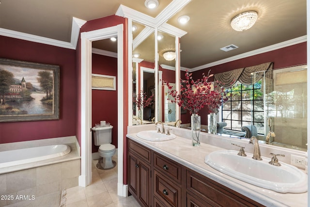 bathroom with tile patterned flooring, toilet, crown molding, vanity, and tiled tub