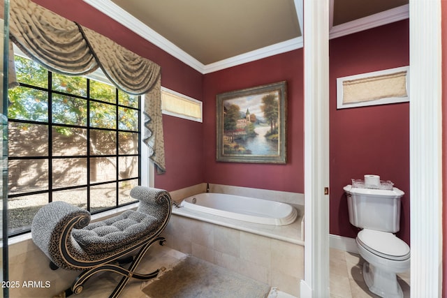 bathroom featuring tile patterned floors, crown molding, tiled bath, and toilet