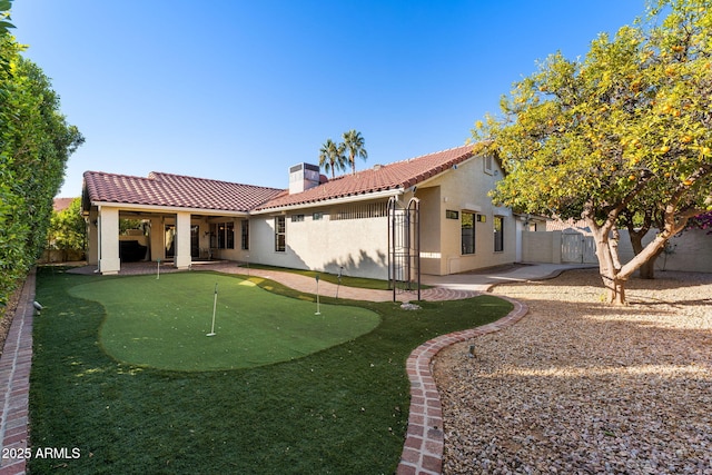 rear view of house featuring a patio