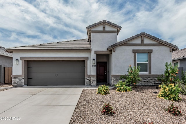 2923 W Shanley Ave, Apache Junction, AZ 85120 - view of front of property with an attached garage, driveway, stone siding, and a tiled roof