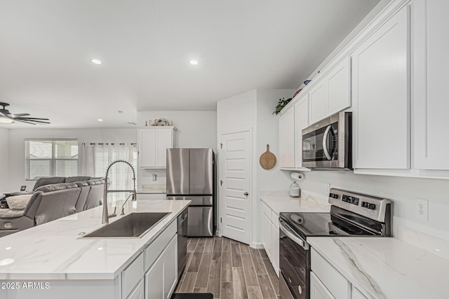 2923 W Shanley Ave, Apache Junction, AZ 85120 - kitchen with a sink, stainless steel appliances, open floor plan, recessed lighting, and a ceiling fan
