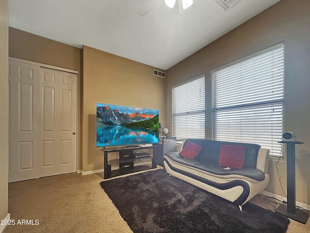 living room with carpet and ceiling fan