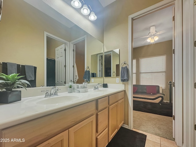 bathroom with ceiling fan, tile patterned floors, and vanity